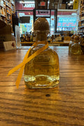 Patron Anejo 200mL clear bottle with cork top. 