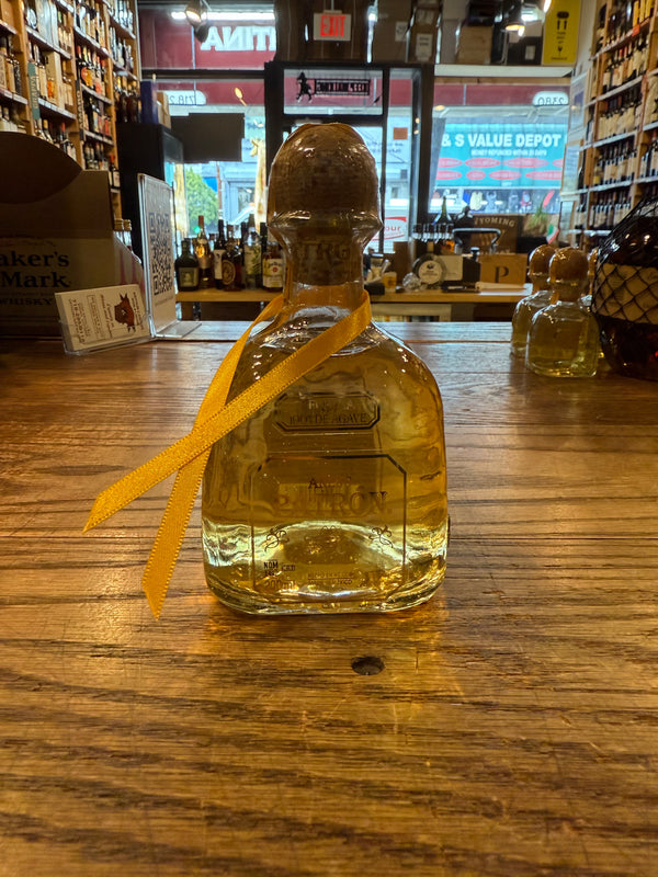 Patron Anejo 200mL clear bottle with cork top. 
