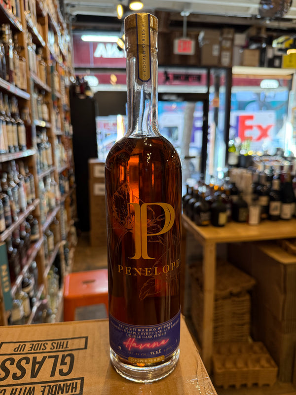 Clear tall bottle with dark blue small label.