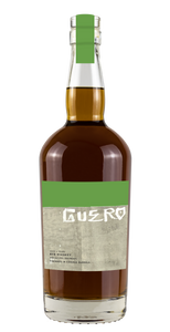 Guero 6YR Rye 750mL a rounded high shouldered clear bottle with a green and gray label 