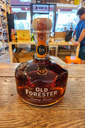 Old Forster Birthday Bourbon 2024 750mL a short squat clear glass bottle with white lettering and a cork topper.