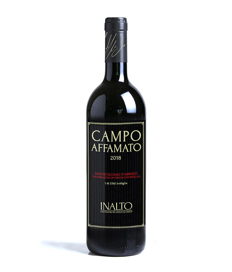 CAMPO AFFAMATO Montepulciano d’Abruzzo a dark wine bottle with a black label with white lettering and black top