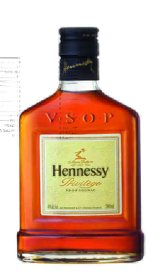 short flat bottle with metal cap, embossed letters "VSOP", small off white square label with the words Hennessy Privilege