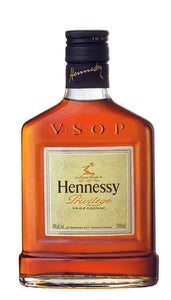 short flat bottle with metal cap, embossed letters "VSOP", small off white square label with the words Hennessy Privilege