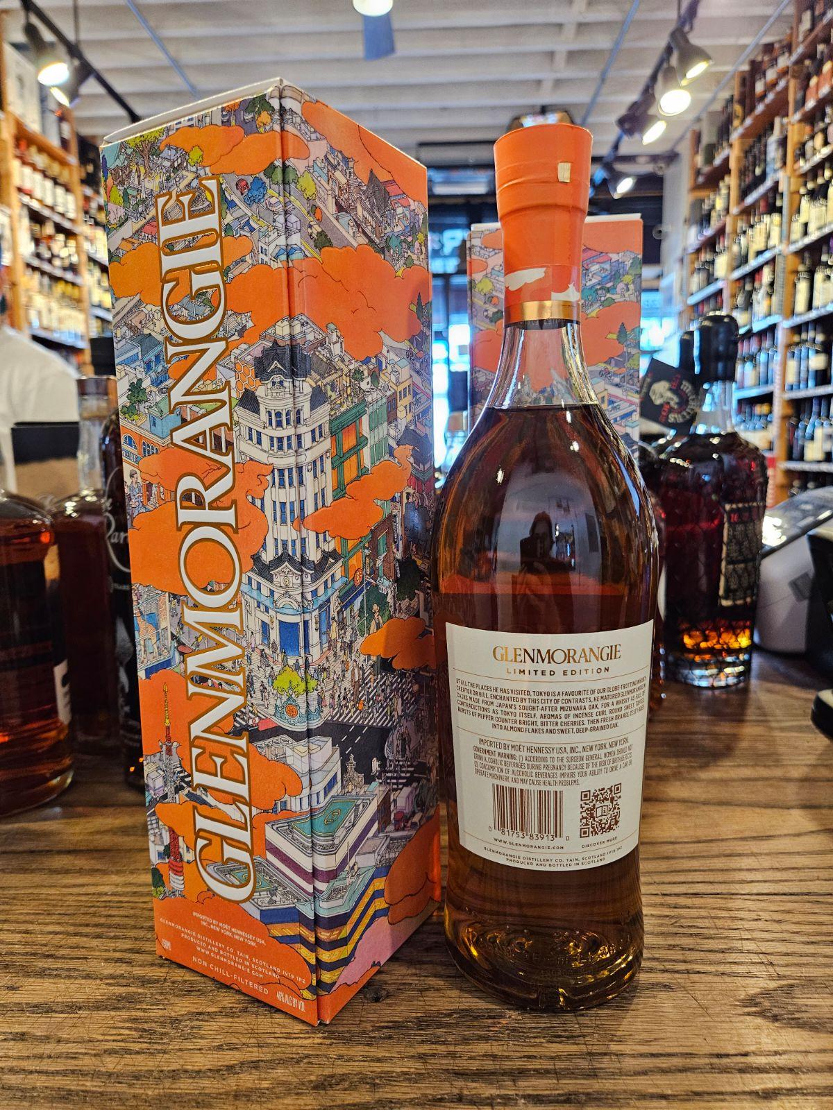 Glenmorangie A Tale Of Tokyo 750mL a tall orange box next to a tall clear bottle with a white label and orange top 