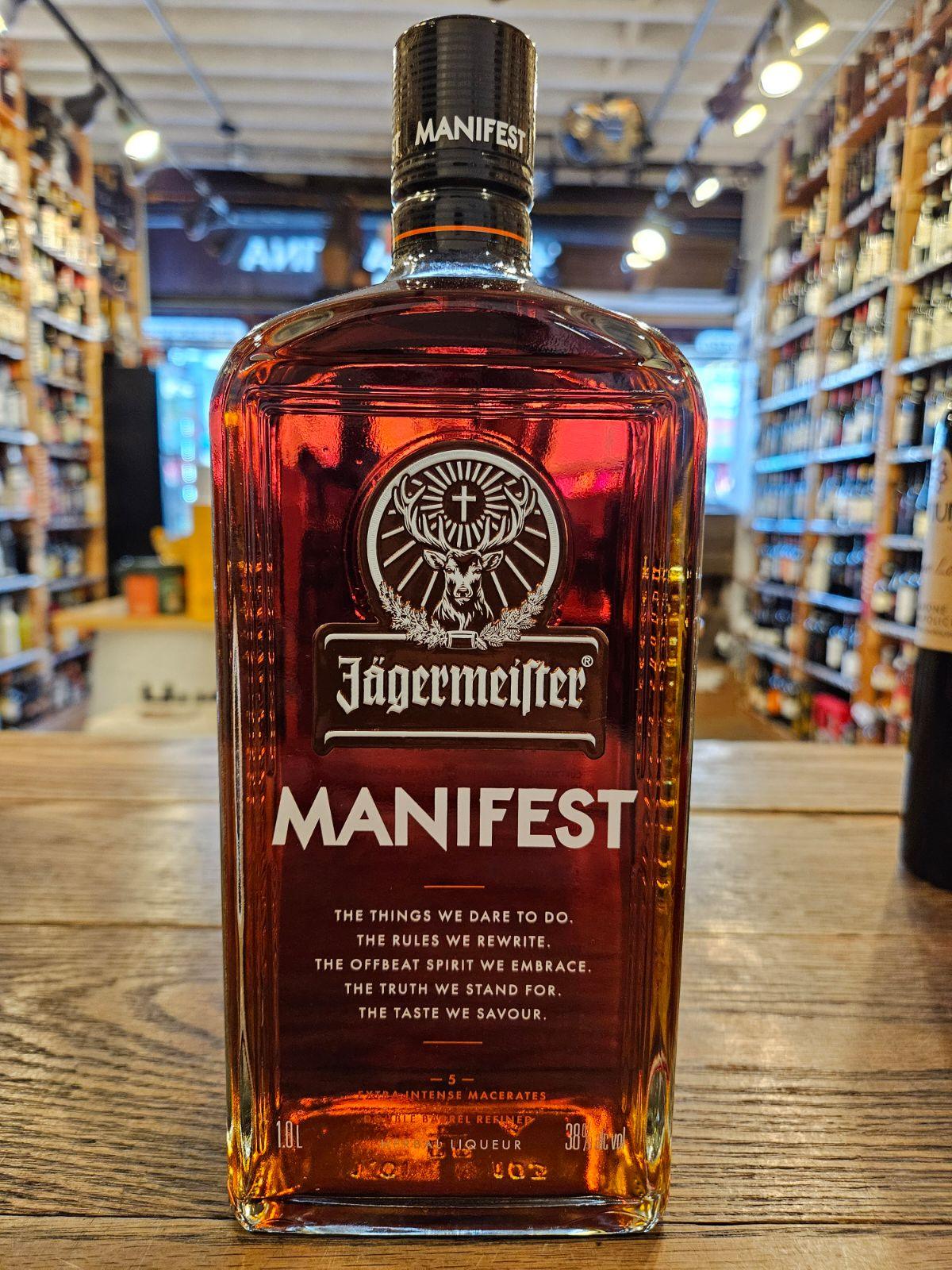 Jagermeister Manifest 1L a large flat faced squared clear glass bottle with white lettering and a black top