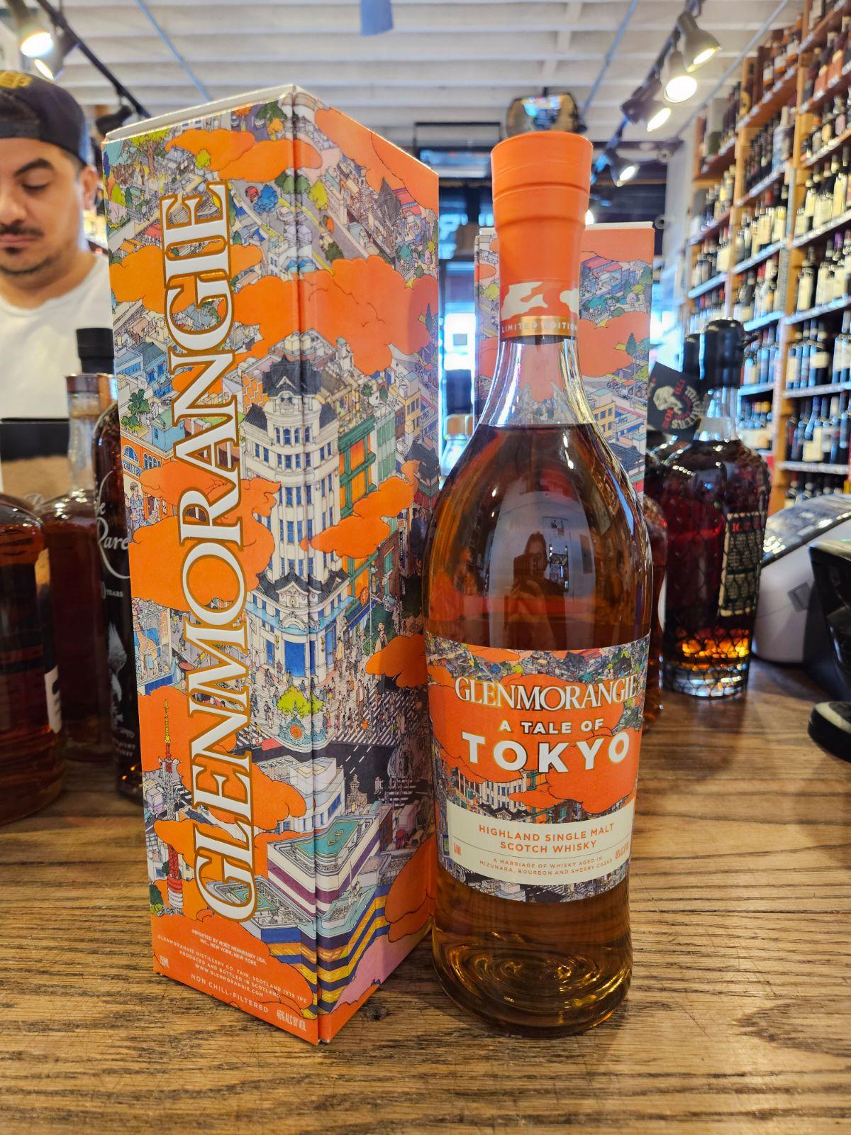 Glenmorangie A Tale Of Tokyo 750mL a tall orange box next to a tall clear bottle with orange label and top