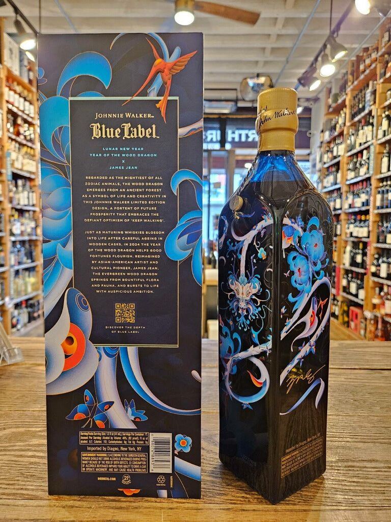 Johnnie Walker Blue Label James Jean Limited Edition Design the backside of a large blue box with a colorful dragon design next to a tall slender blue glass bottle with a blue label and golden top