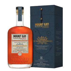 Mount Gay 1703 The Madeira Cask Expression Barbados Rum a flat surfaced square bottle with a white label and black top next to a blue box with gold lettering