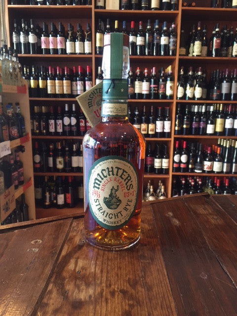 Michter's Rye Single Barrel 750mL a high rounded shouldered clear glass bottle with a beige and green label with a wooden top