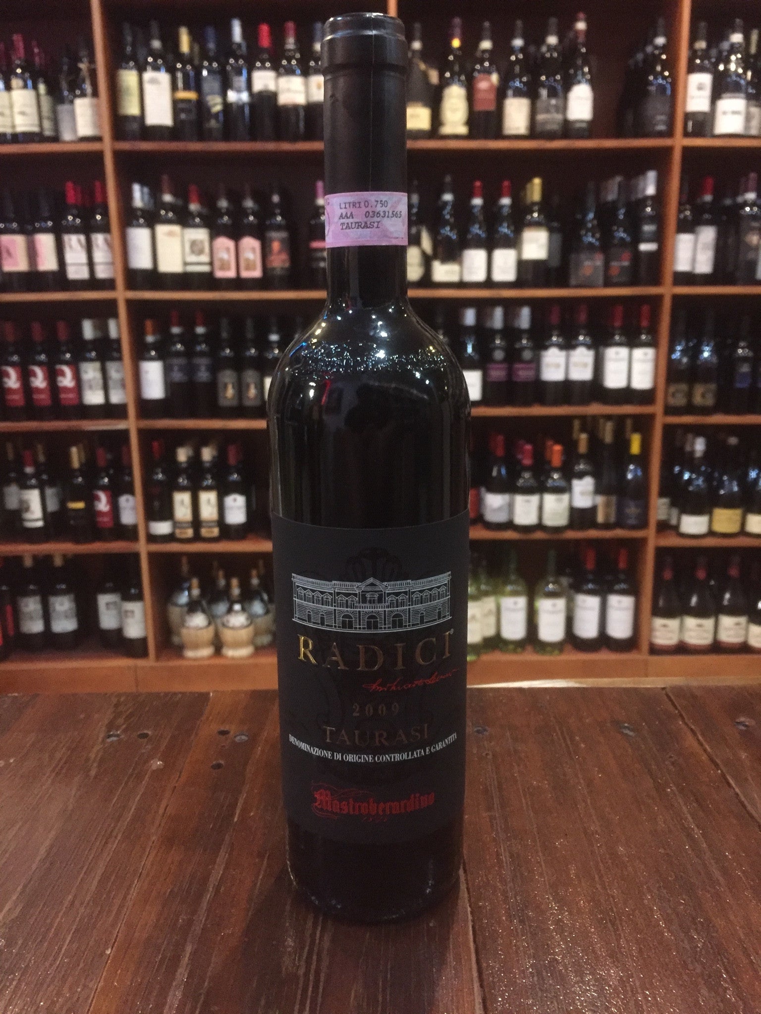 Radici Taurasi Mastroberardino 750mL a tall dark glass wine bottle with a black label and black top