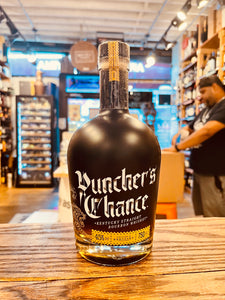 Puncher’s Chance 750mL a short rounded black glass bottle with white lettering and a black top