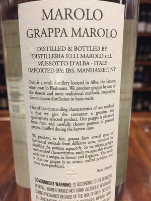 Marolo Grappa Brunello 750ml backside of a clear glass bottle showing the white label