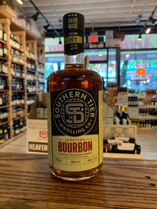Southern Tier Bourbon 750mL  a short rounded shouldered clear glass bottle with a yellow and black label and black top