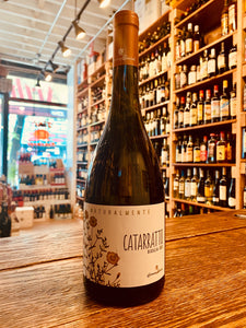 Caruso e Minini Cataratto 750mL wide bottomed dark clear bottle of wine with a white label and rose gold top