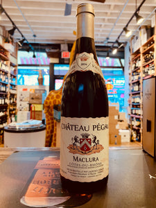 Chateau Pegau Red Cote du Rhone 750mL a wide bottomed dark wine bottle with a white label and silver top
