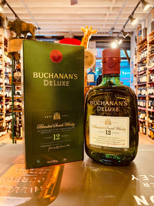 Buchanans 750ml a green square box next to a green squared roundish bottle with a white label and a red top