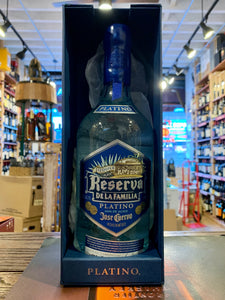 Reserva de la Familia Platino 750mL a blue box open with a clear high shouldered rounded bottle inside with a blue label and blue wax top