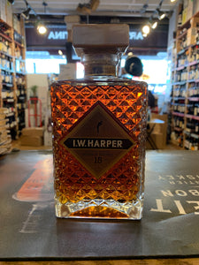 I.W. Harper 15 yr 750mL short squared squat bottle with diamond cut engraving on the clear bottle with a gold label and large square golden top