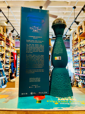 Clase Azul Mezcal Guerrero 750mL the back of a tall elegantly designed green bottle with a silver bell topper next to a green tall box