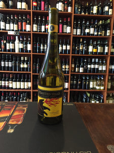 Toasted Head Chardonnay 750ml a clear green glass tapered wine bottle with a yellow label and cork top