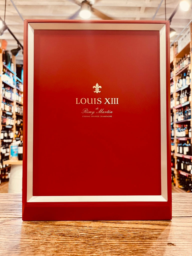 Louis XIII the front side of a red box with silver lettering