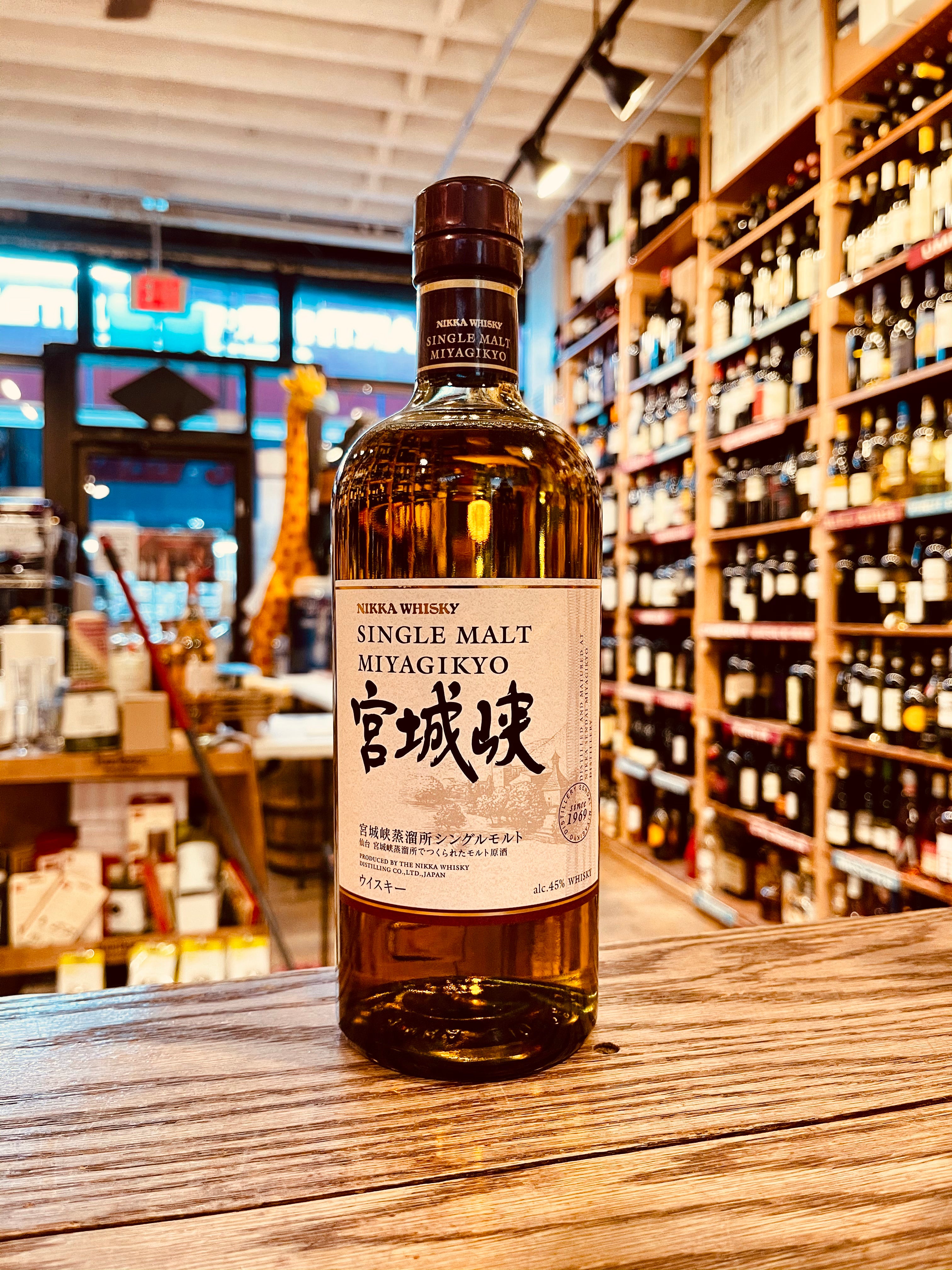 Nikka Miyagikyo Single Malt Whisky 750mL a high shouldered round clear glass bottle with a white label and a brown top