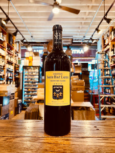 Chateau Smith Haut Lafitte 750mL a dark wine bottle with a yellow label and black top