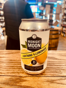 Midnight Moon Lightning Lemonade 355mL a silver can with a white label and image of lemons on it