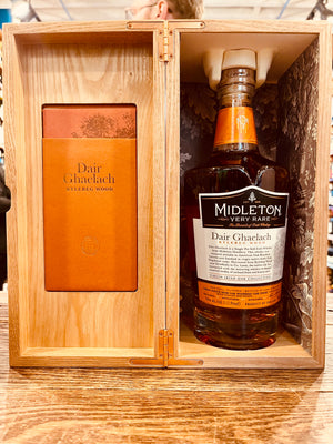 Midleton Very Rare Whiskey Dair Ghaelach Kylebeg Wood Tree No4 700mL an open wooden box with an orange leaflet on one side and a clear high rounded shouldered glass bottle with a white label and wooden top