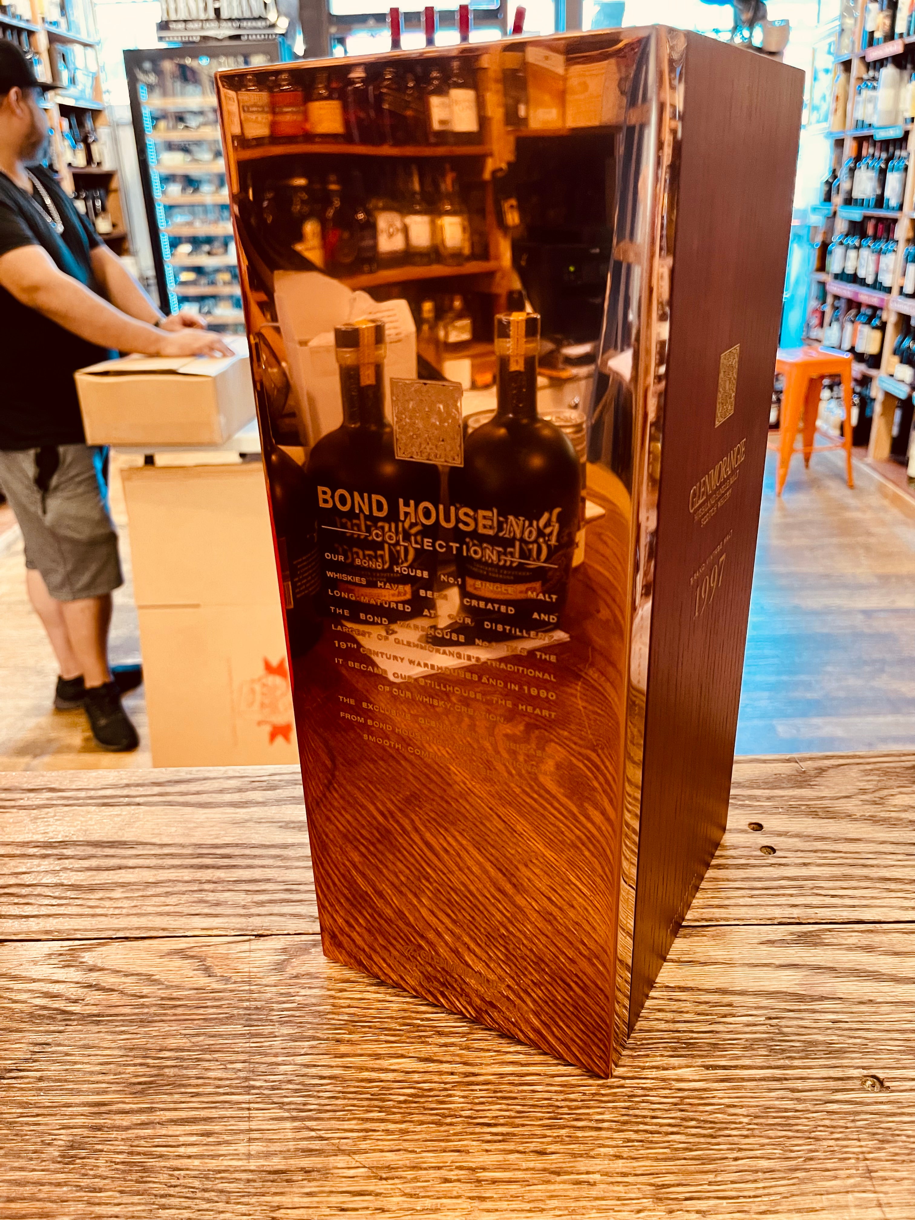 Glenmorangie 1997 Bond House No.1 750mL a tall wooden box with a reflective brass plating 
