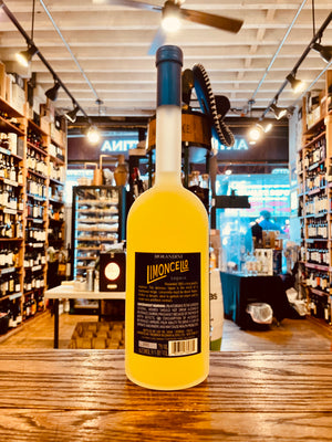 Morandini Limoncello 700mL a tall thin necked frosted glass bottle with a blue label and blue top