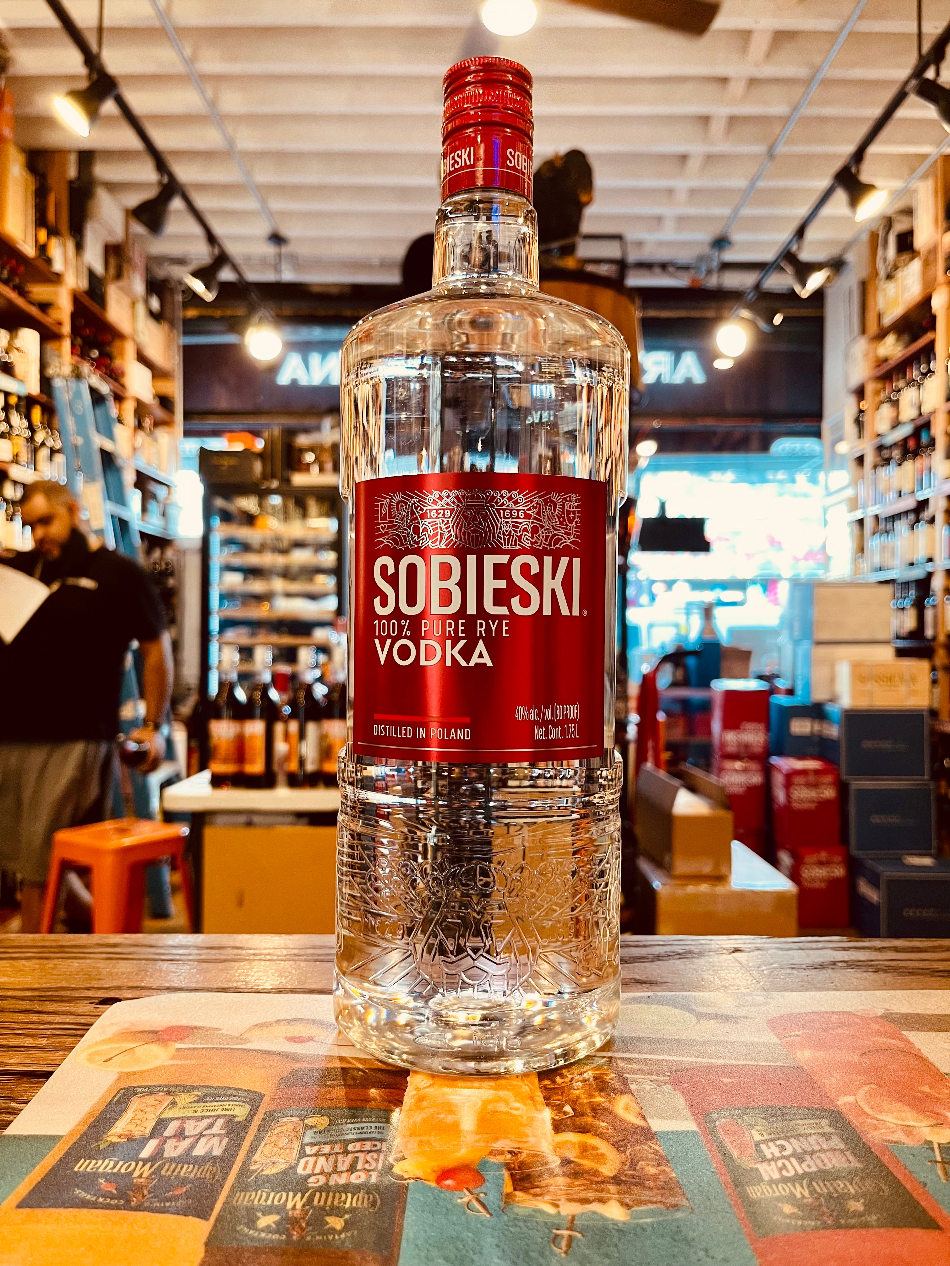 Sobieski Vodka 80 1.75L a large clear glass bottle with a short neck and a big red label and red top