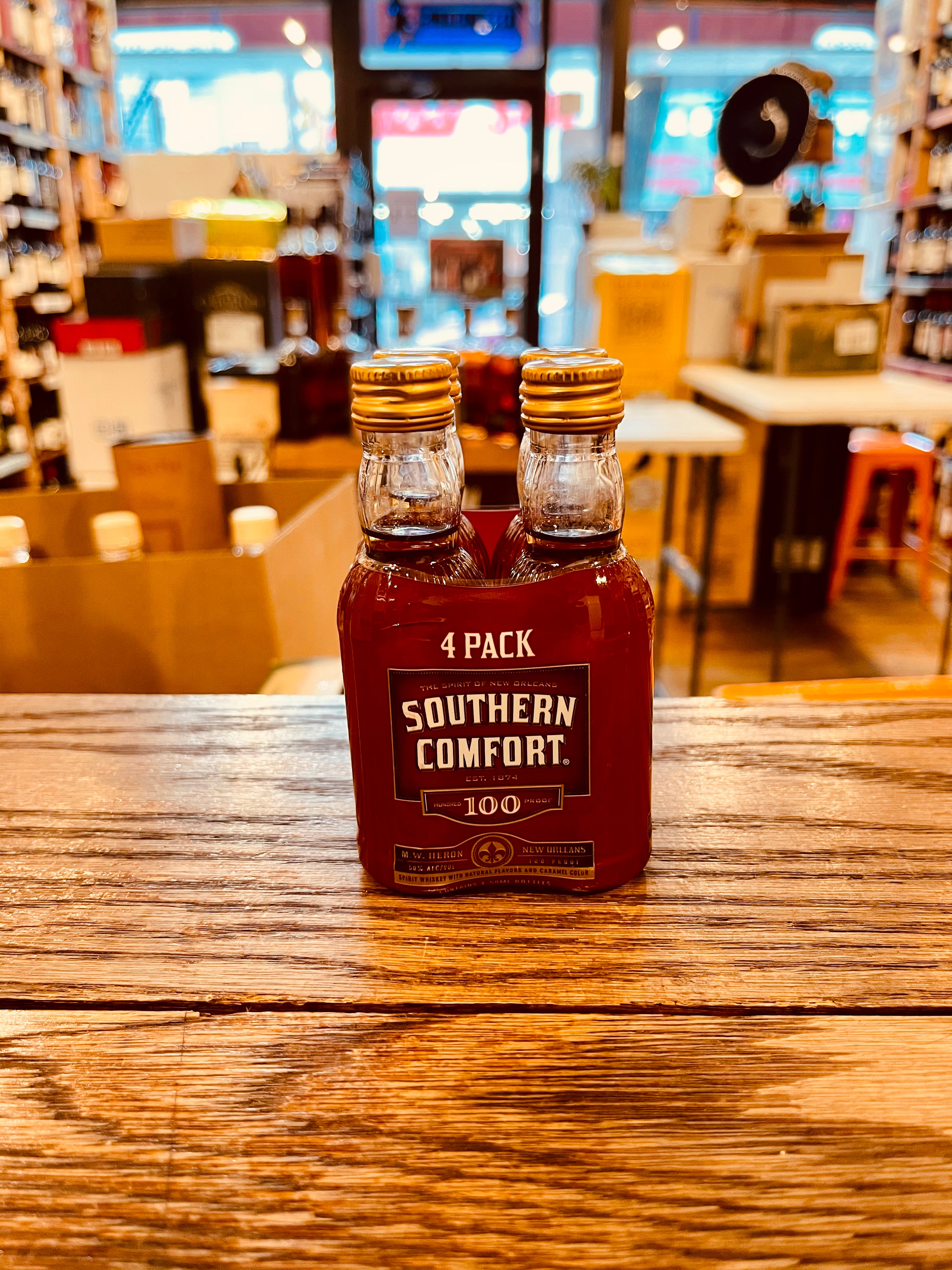 Southern Comfort 50mL two small plastic clear bottles with a red label and gold top