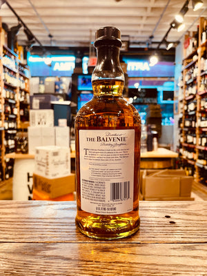 The Balvenie 12Yr The Sweet Toast of American Oak 750mL the backside of a robust clear glass bottle with a white label and black top