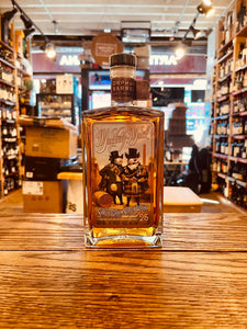 Orphan Barrel Muckety Muck 25YR Single Grain Scotch Whisky 750mL a flat surfaced squared bottle with the image of two dressed pigs on it and a black top