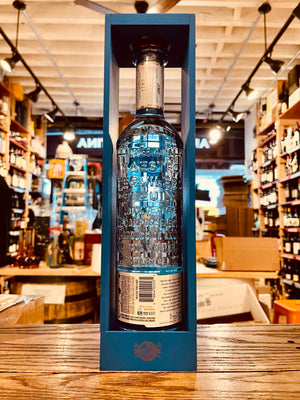 Maestro Dobel Pavito 750mL the backside of an open ended blue wooden box with a clear blue glass bottle inside with a white label