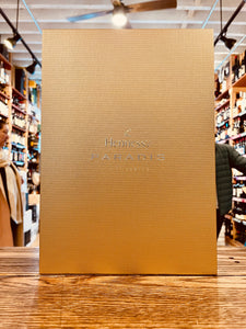 Hennessy Paradis 750mL a large flat gold box with reflective gold lettering