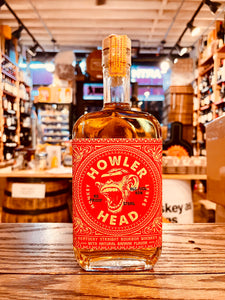 Howler Head 375mL a flat surfaced squared clear glass bottle with a red label and image of a monkey with sunglasses on it