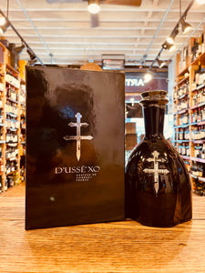 D'usse Cognac XO 750mL a black square box with silver lettering next to a small stout roundish black bottle with silver emblem 