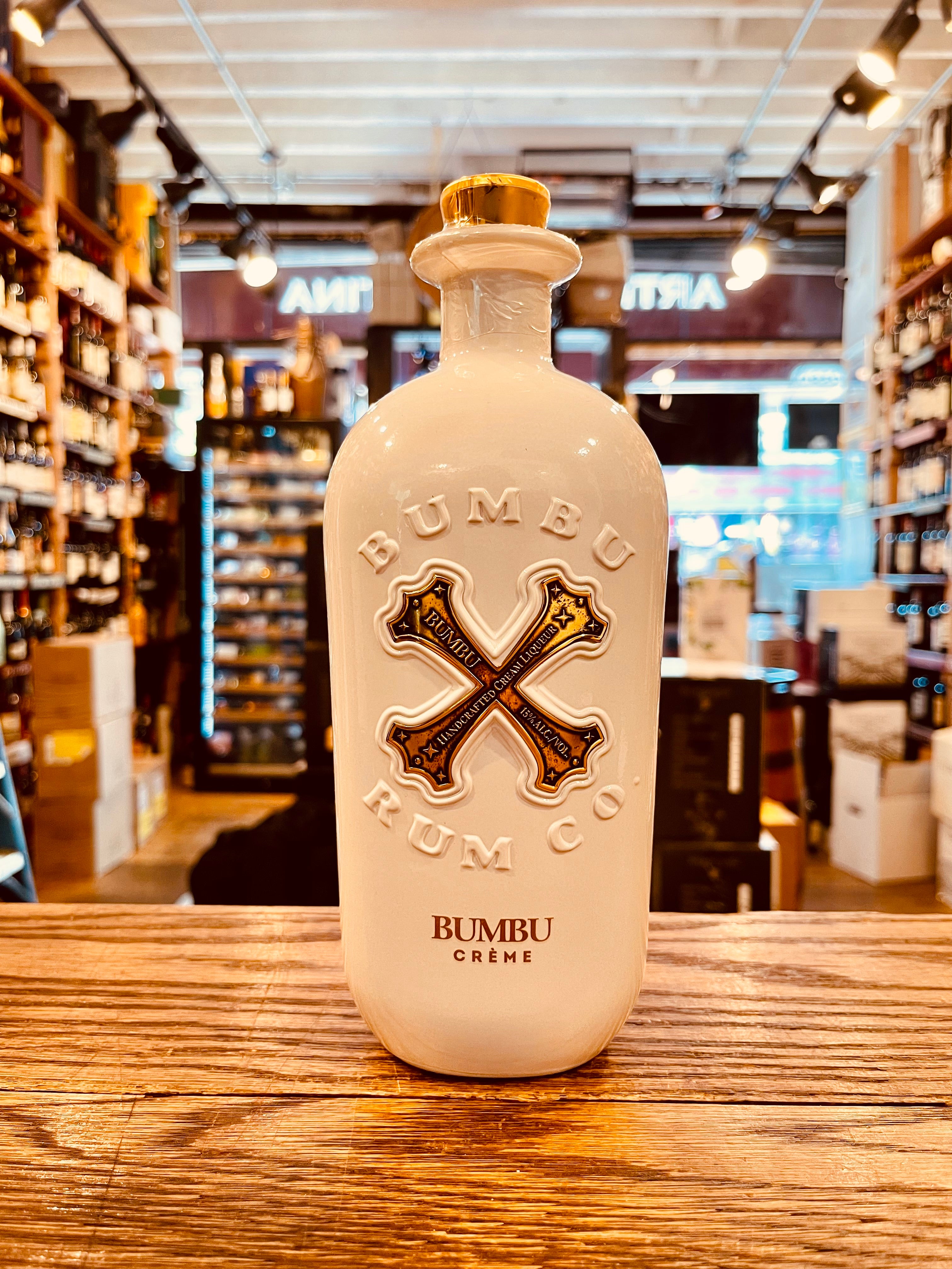 Bumbu Rum Creme Liqueur 750mL a white rounded short necked bottle with a gold top