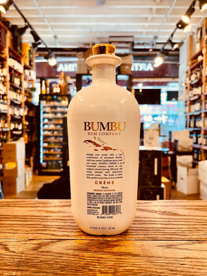 Bumbu Rum Creme Liqueur 750mL a white rounded short necked bottle with a gold top