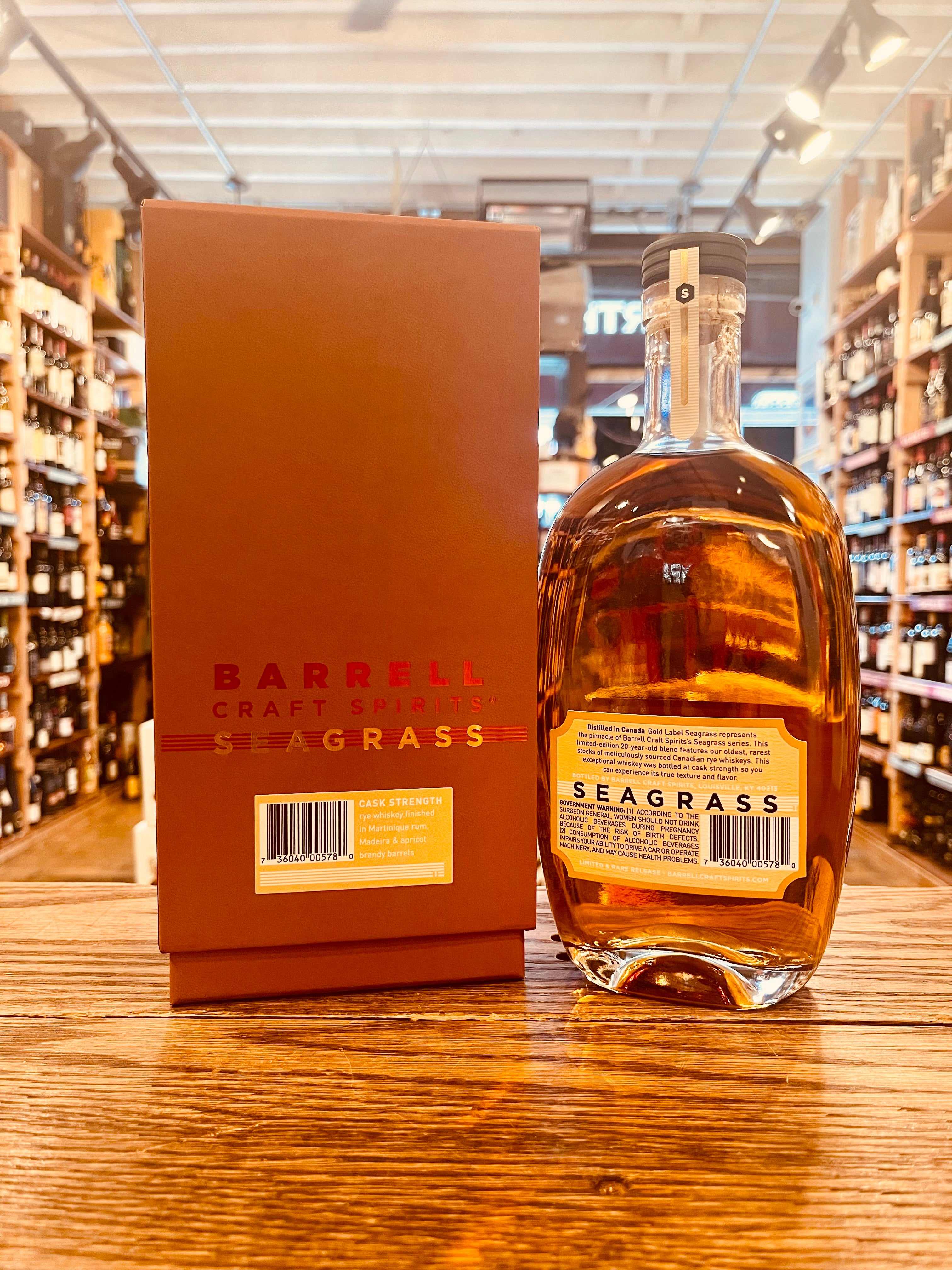 Barrell Craft Spirits Seagrass (Gold Label) 750mL rustic colored box next to an oval shaped bottle with yellow labeling