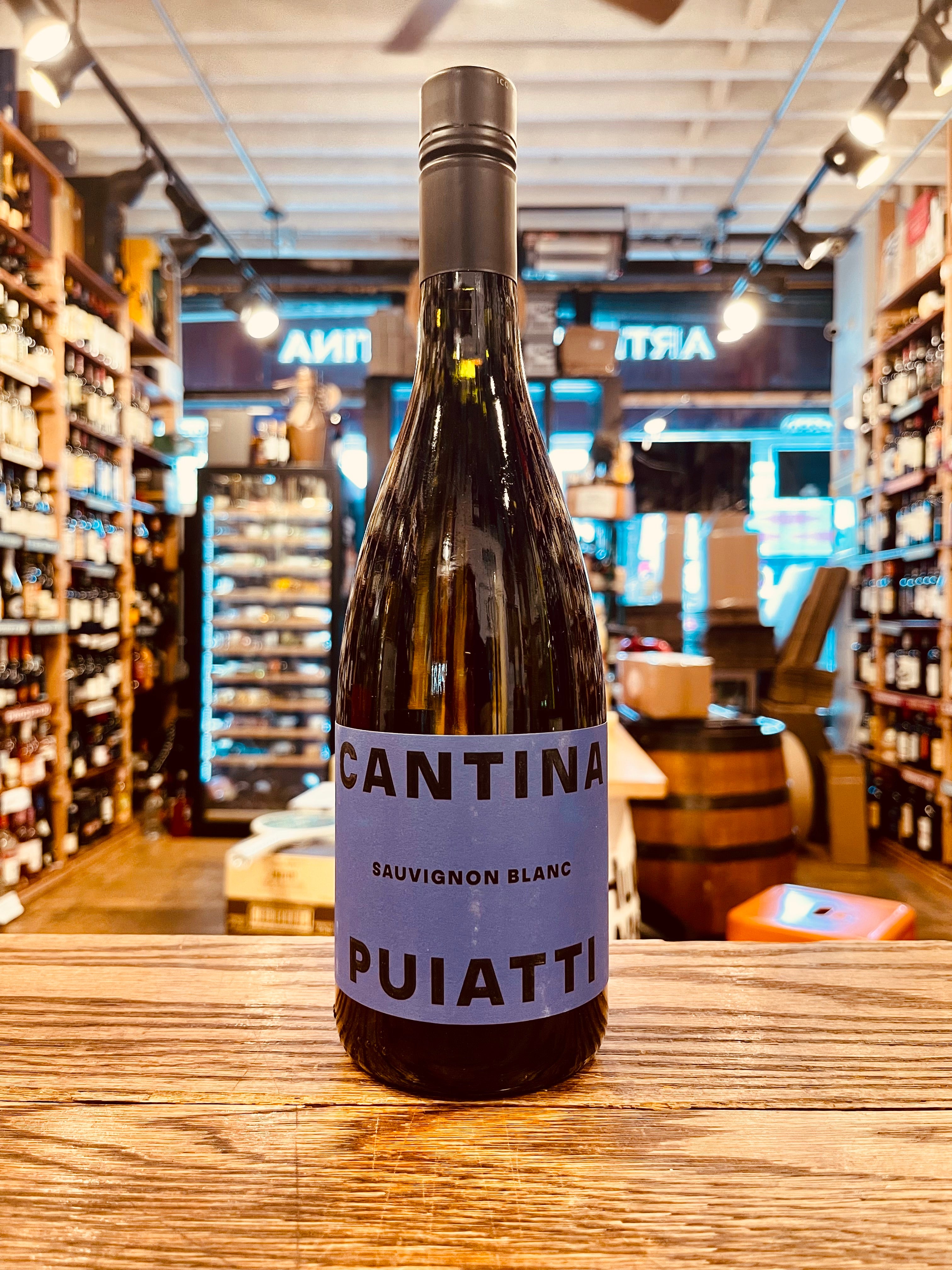 Cantina Puiatti Sauvignon Blanc 750mL Friuli a wide bottom dark wine bottle with a blue label and a black top