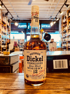 George Dickel Tennessee Sour Mash 12 yr 750mL a rounded clear bottle with a long neck and white label