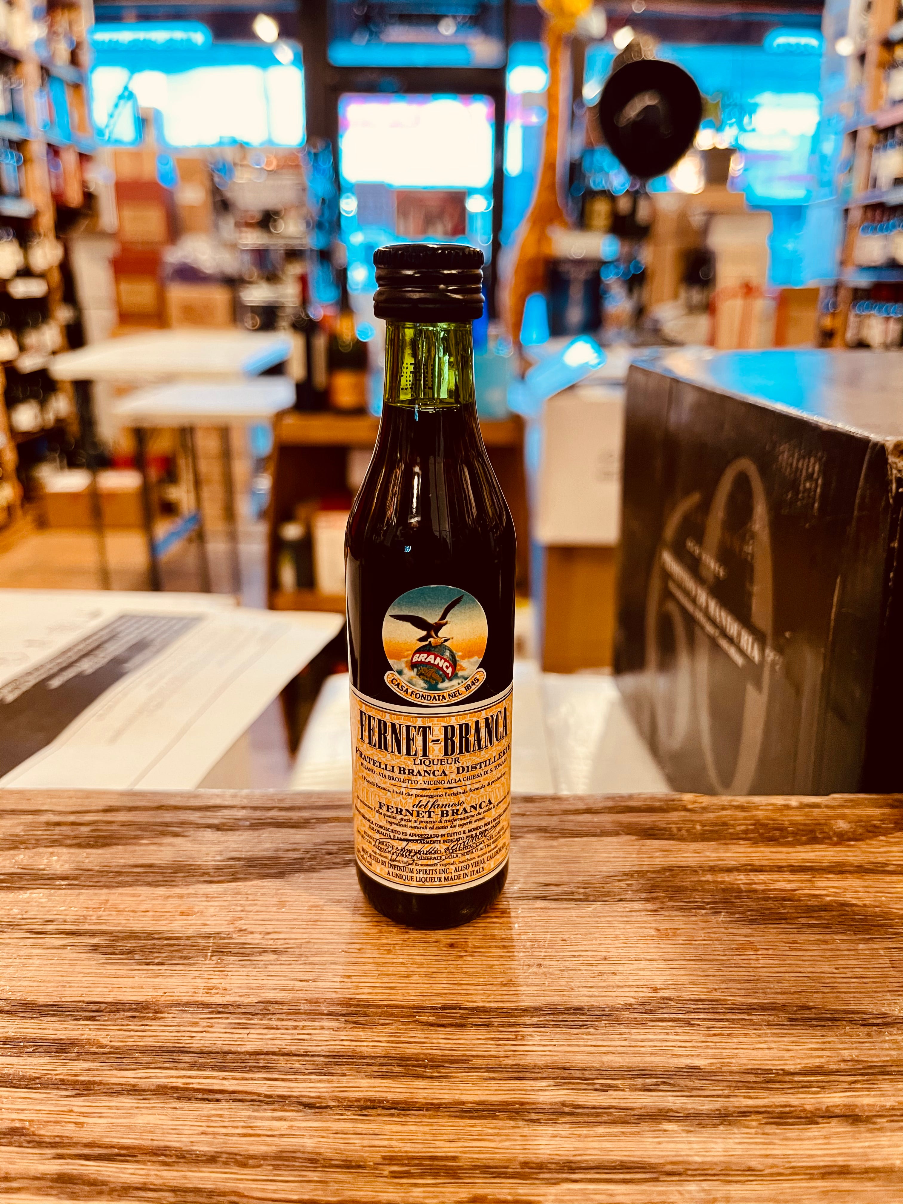 Fernet Branca 50mL a small dark green bottle with a beige label and dark top