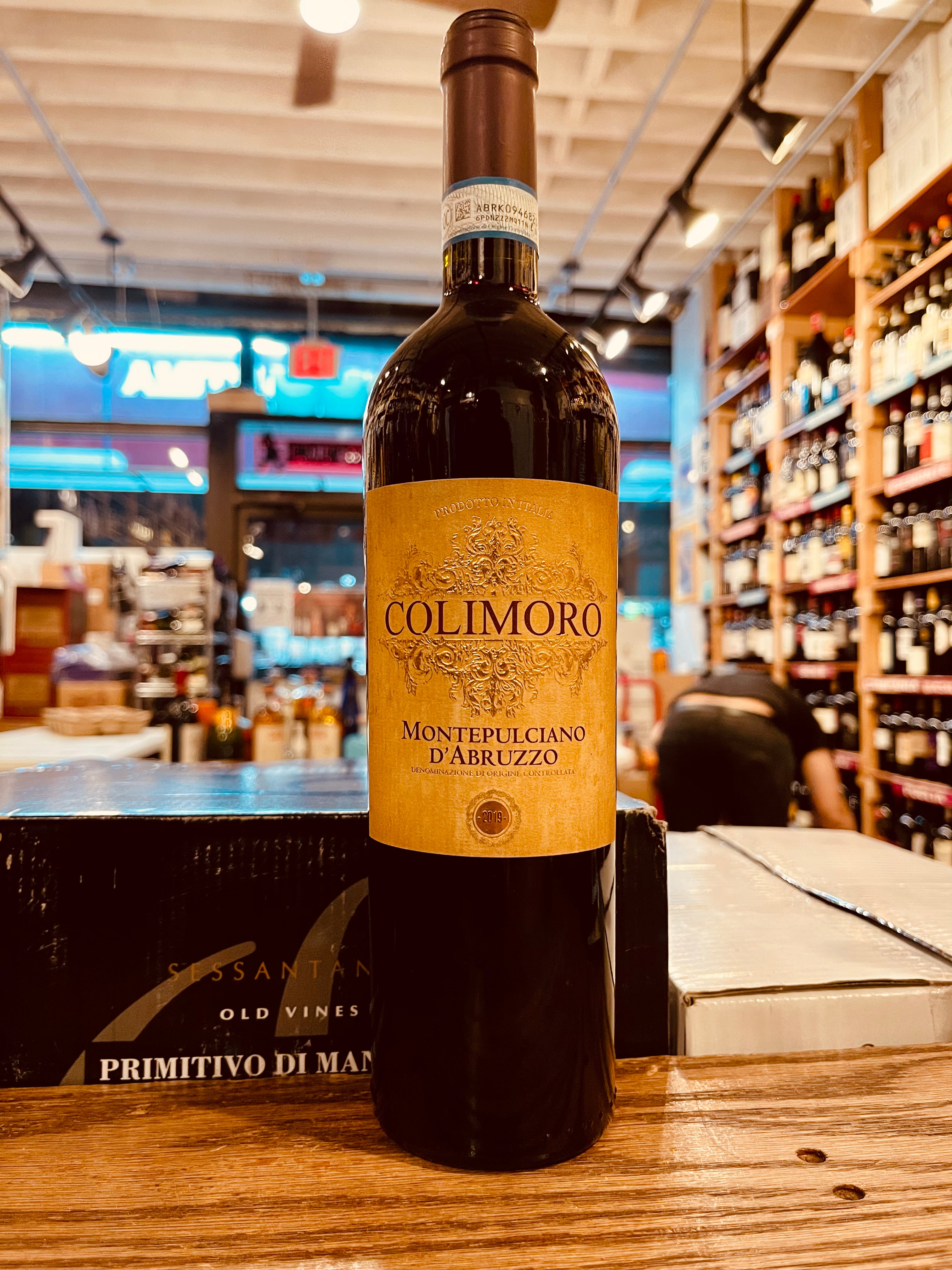 Colimoro Montepulciano d'Abruzzo 750mL dark wine bottle with a beige colored label and brown top