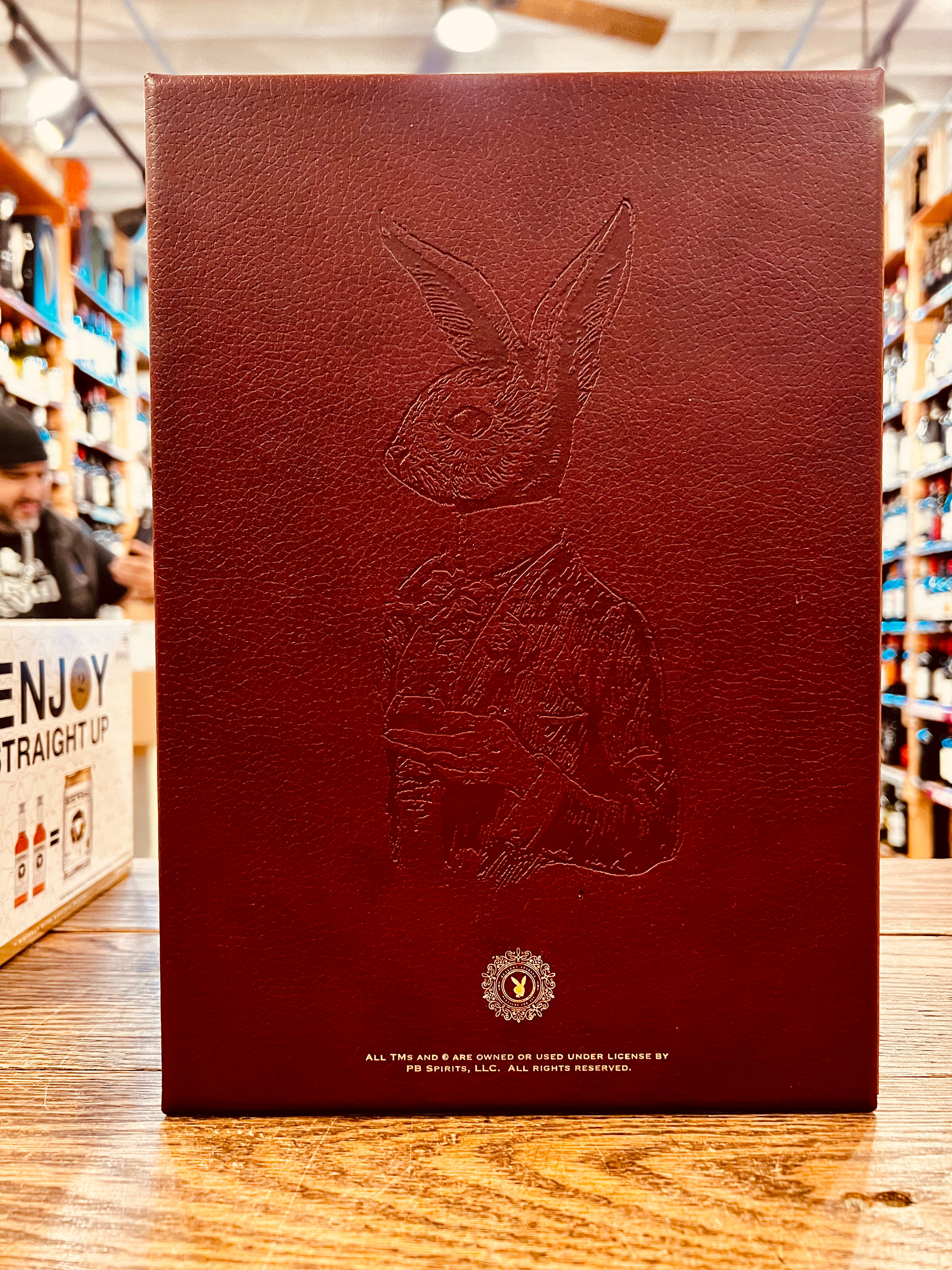 Rare Hare Cognac Lapine Aged 60 Years 750mL a dark red leather box with the image of a well dressed rabbit engraved on the front