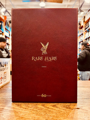 Rare Hare Cognac Lapine Aged 60 Years 750mL a red leather box with golden lettering and golden rabbit head on the front