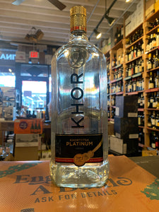Khor Platinum Vodka 1.75L a large wide clear glass bottle with a black label and golden top